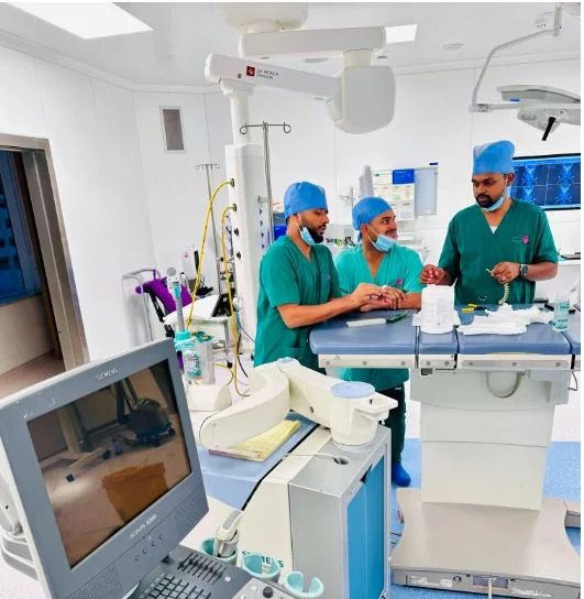 Biomedical engineer performing medical equipment installation in a Dubai hospital